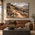The Long Way Home: winding desert trail with a rattlesnake on a foreground rock, stretched frameless room mockup